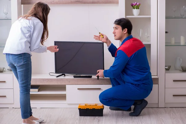 depositphotos 197324438 stock photo tv repairman technician repairing tv